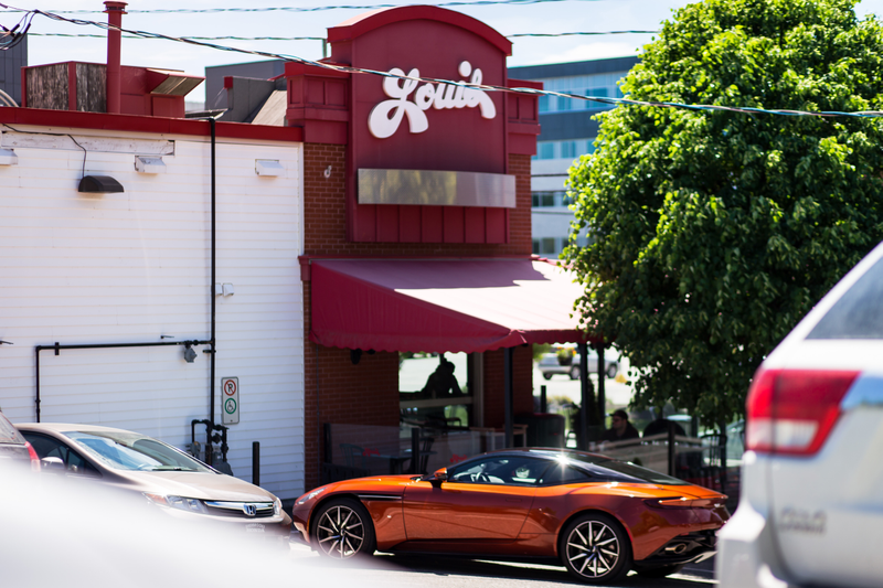 Illustration for article titled Chasing Canada's Greasiest People's Food In A $200,000 Aston Martin